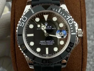 A black-dialled diving watch on a brown leather cushion