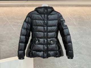 A short black quilted puffer jacket shown from the front